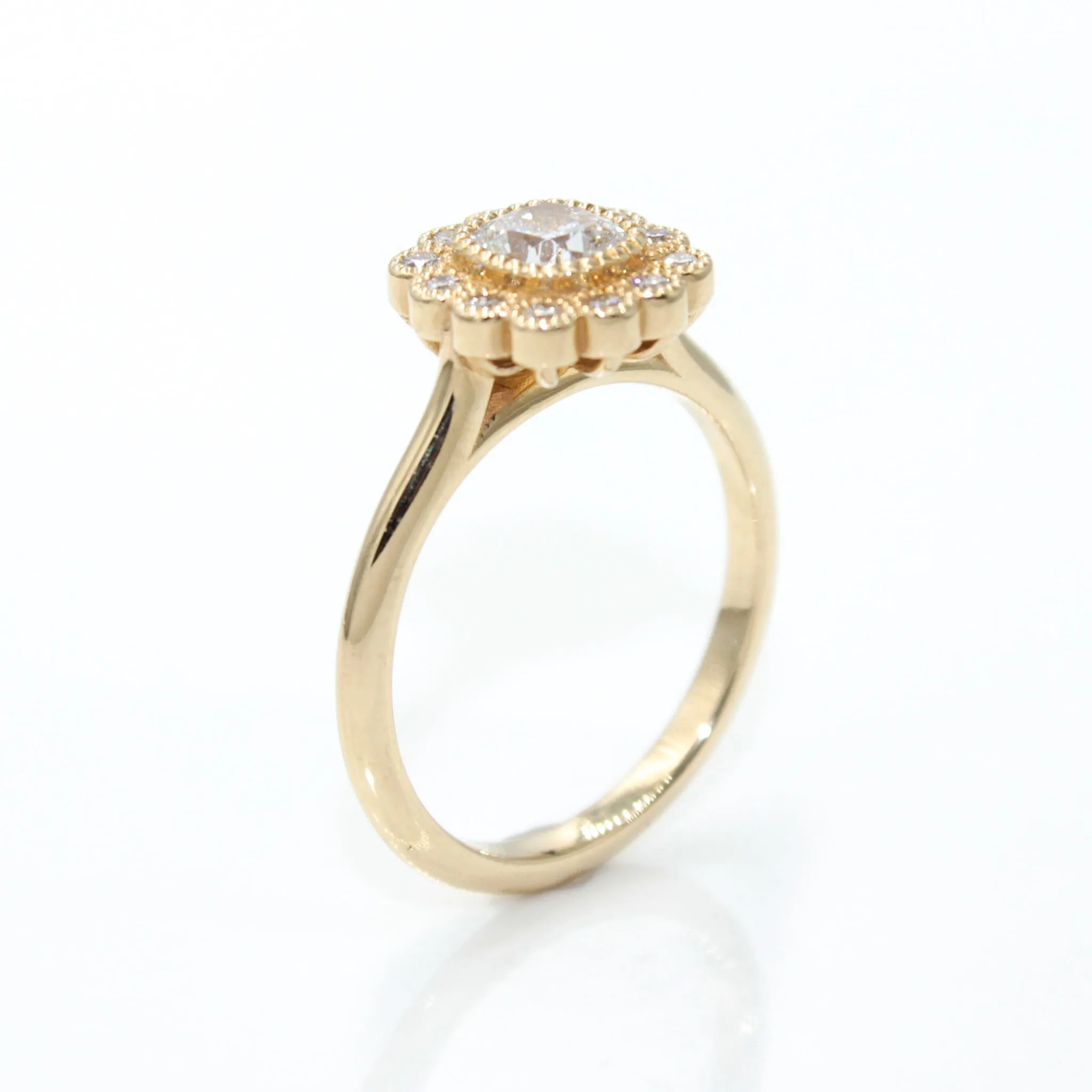14K Yellow Gold Engagement Ring Featuring a Cushion Cut Diamond with Halo